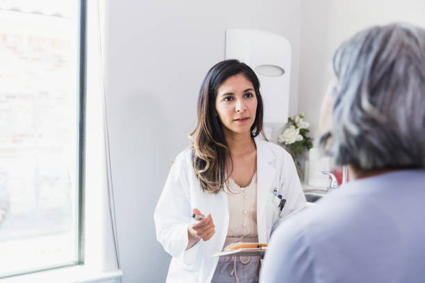 istock Confident doctor discusses patient's health 1271564700