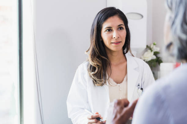 istock Compassionate female doctor with patient 1271564704