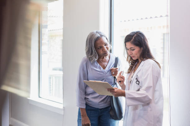 istock Concerned patient listens to doctor 1271564741