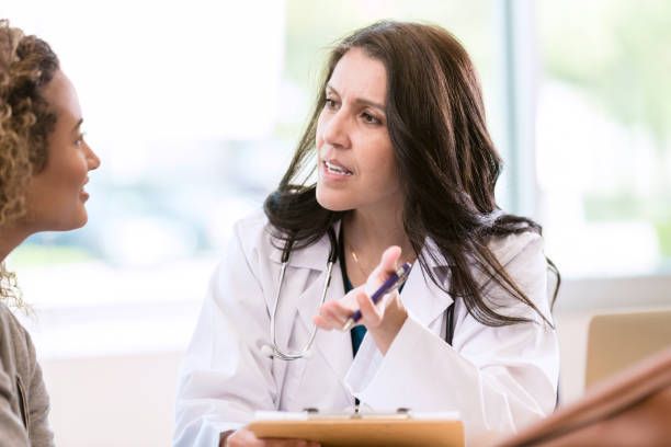 istock Serious doctor talking with patient 1271564791