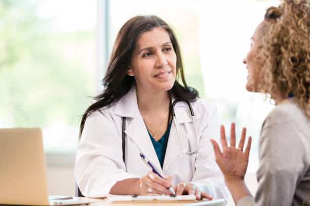istock Female patient talking with doctor 1271564865