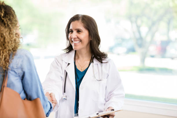 istock Doctor greets new patient 1271564902