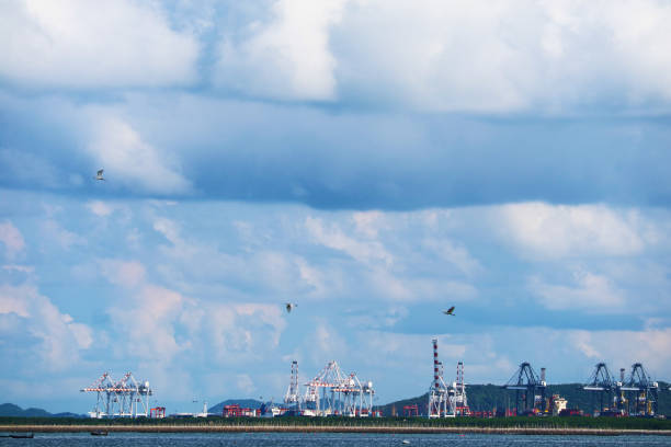istock blue sky huge white gray cloud and  seaport industrial zone 1271568050
