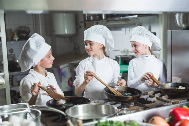 istock Children cook eggs in the kitchen at the Restaurant. 1271569385