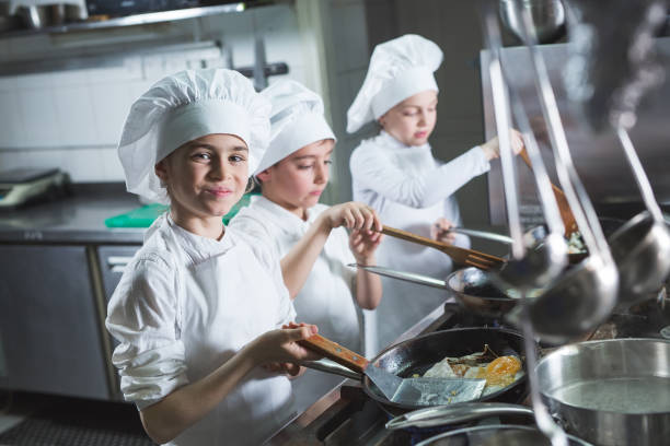 istock Children cook eggs in the kitchen at the Restaurant. 1271569655