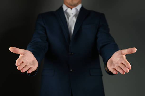 istock The man in the suit stretches his palms forward 1271569891