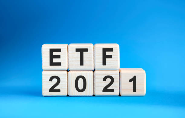 istock ETF 2021 years on wooden cubes on a blue background 1271571172