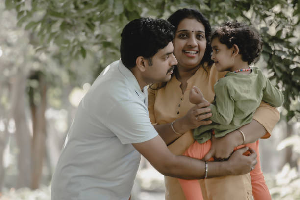 istock Family has fun playing in the park 1271572351