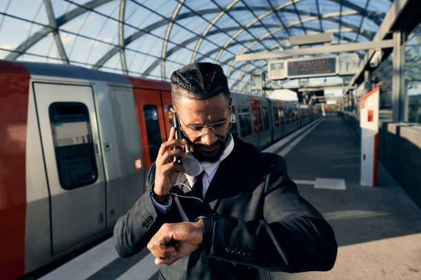 istock Handsome entrepreneur at the train station with a face mask 1271573806