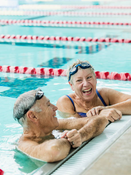 istock Senior couple exercising together, swimming laps 1271575662
