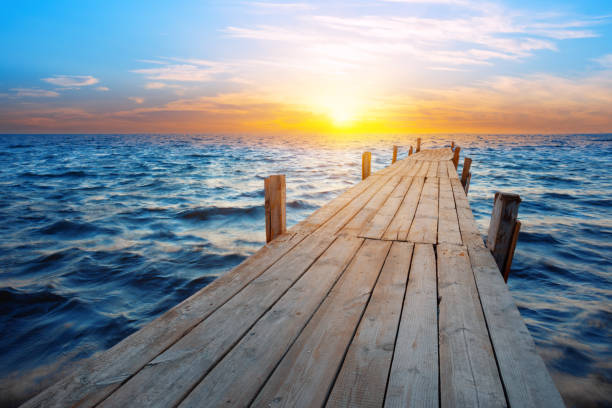 istock The pier leaving sea at sunset 1271579324