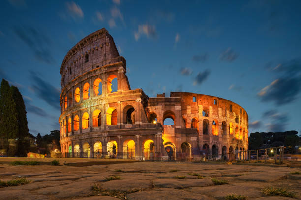 Colosseum in Rome at night with lights on