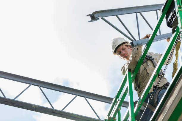 istock Construction worker on scissor lift moving roof joist 1271581615
