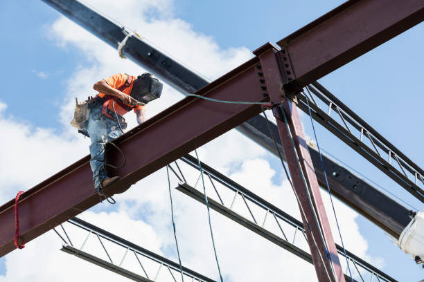 istock Ironworker at construction site installing roof joist 1271582240