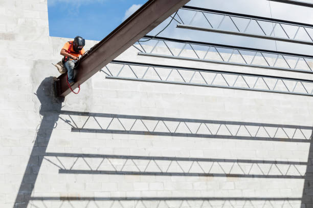 istock Ironworker at construction site installing roof joist 1271582604