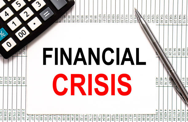 istock paper note with FINANCIAL CRISIS Message. Concept Image 1271590011
