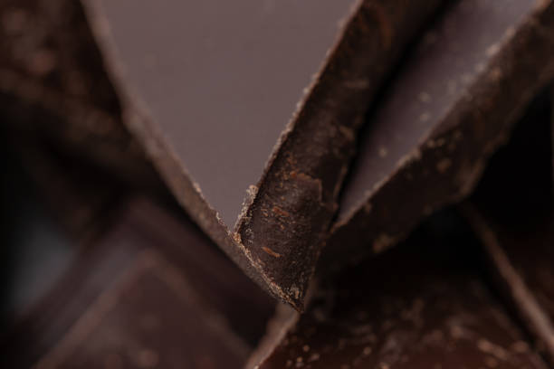 istock Dark chocolate cracked pieces closeup macro 1271591153