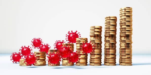 istock Coronavirus with stacked coins 1271592173