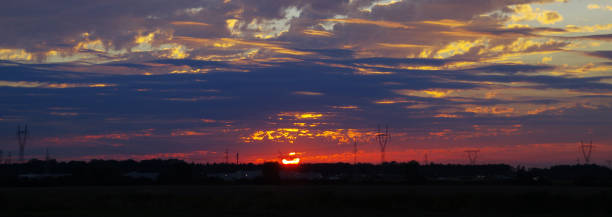 istock Electric energy tower silhouette on sunset sky 1271592209