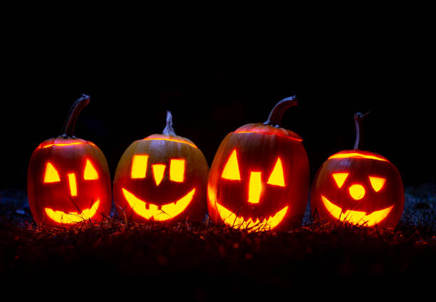 istock Halloween pumpkins over blue background with smoke. 1271593967