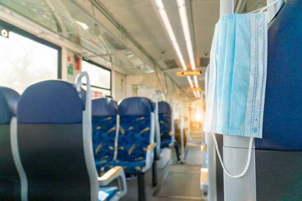 istock Empty inside train bus subway public transport with window view and blue seats people tourist new normal social distancing safe travel with hygiene face mask protect from covid corona virus 1271595993