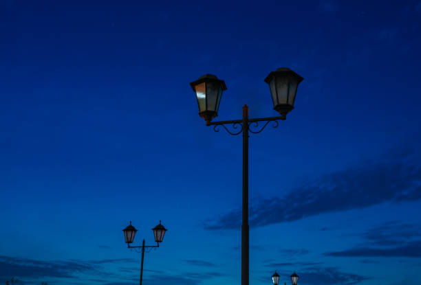 istock Old-fashioned street lamp at night. Two lanterns 1271596585