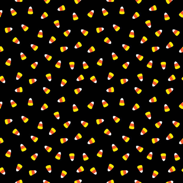 Little Candy Corn Seamless Pattern Vector seamless patten of little candy corn candies on a black background. halloween patterns stock illustrations