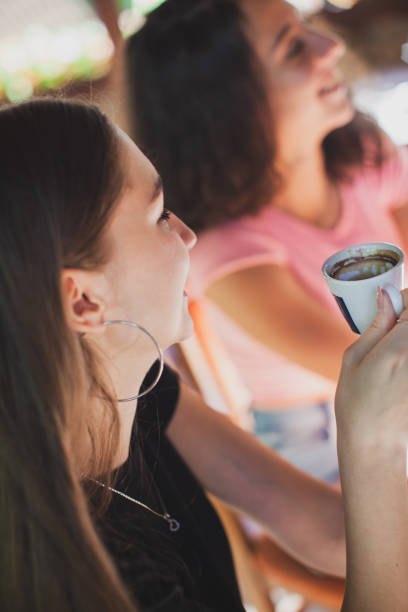 istock Women having fun during coffee time in a coffee shop 1271596636