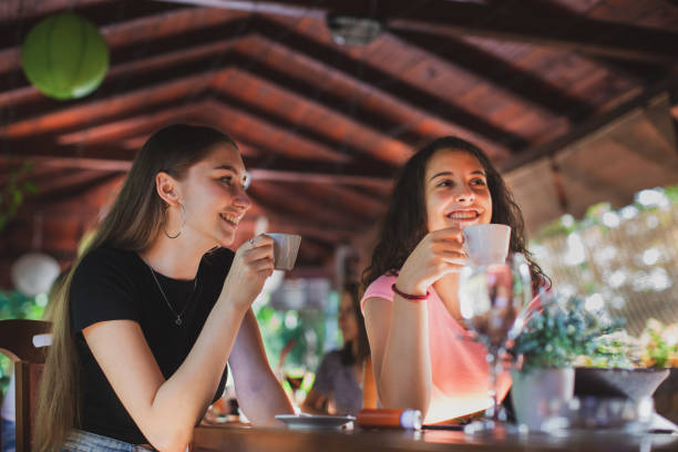 istock Women having fun during coffee time in a coffee shop 1271596656