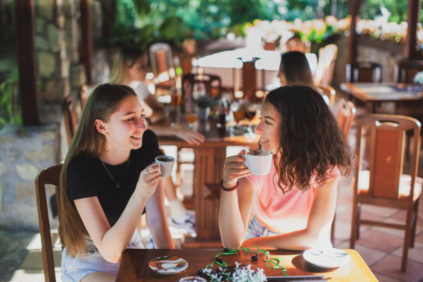 istock Women having fun during coffee time in a coffee shop 1271596710