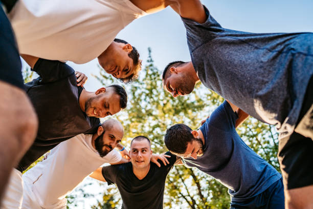 istock Soccer players huddling on field 1271598641