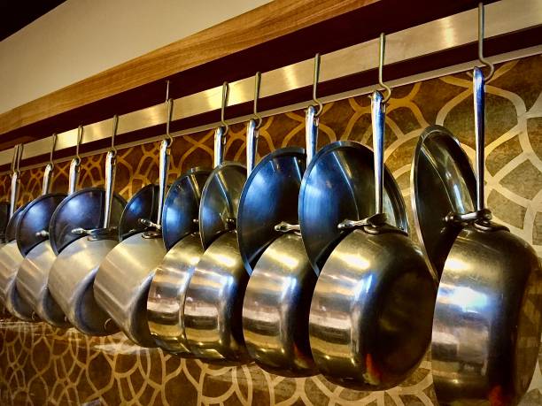 istock Hanging Shiny Pots and Pans Ready for Action 1271599654