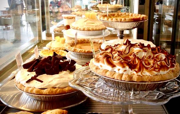 Multiple Pies Galore! The pie shop display cabinet stock pictures, royalty-free photos & images