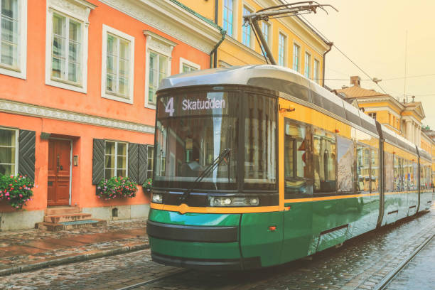 istock Green tram passing Helsinki city, Finland 1271601033