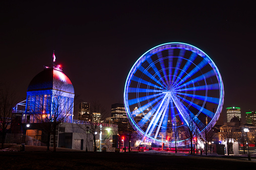 merry go round swing at night with colorful light at city fair ground from different angle