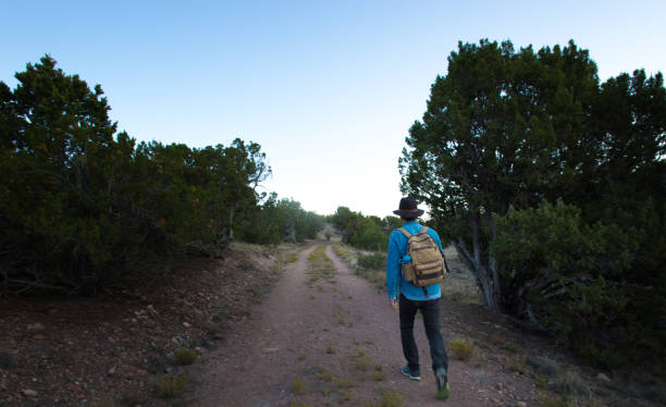 istock Man Hikes at Dawn at Galisteo Basin Preserve (NM) 1271605757