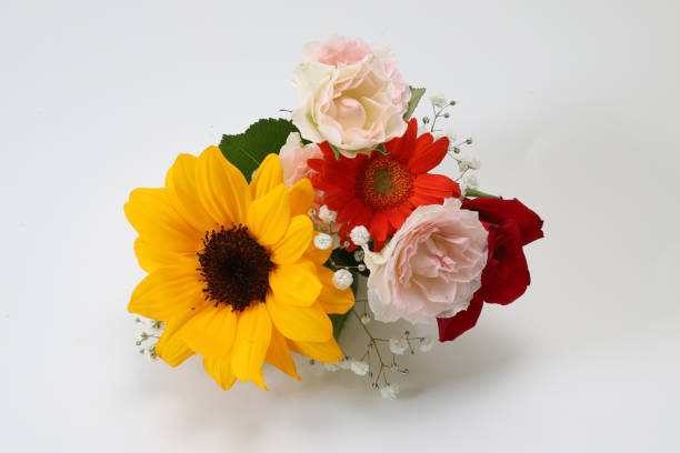 Bouquet of sunflowers and roses in a Porcelain Vase