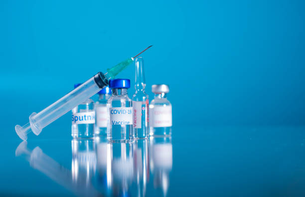 istock Coronavirus vaccine example. Glass needle bulbs and needle 1271607087