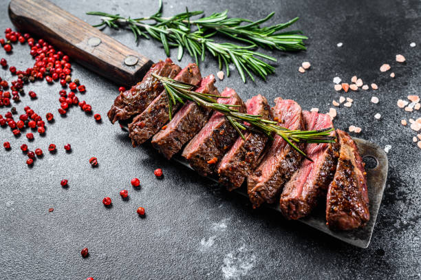 istock Grilled skirt, machete steak. Marble meat beef. Black background. Top view 1271608847