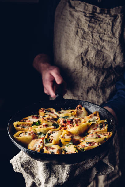 Skillet of pasta stuffed with ground beef, spinach and cheese
