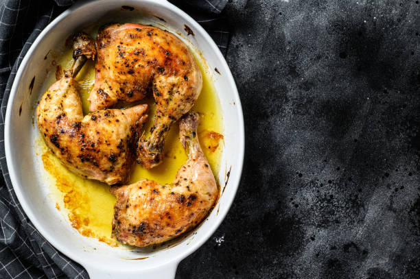 istock Fried chicken thighs, legs with spices. Black background. Top view. Copy space 1271609789
