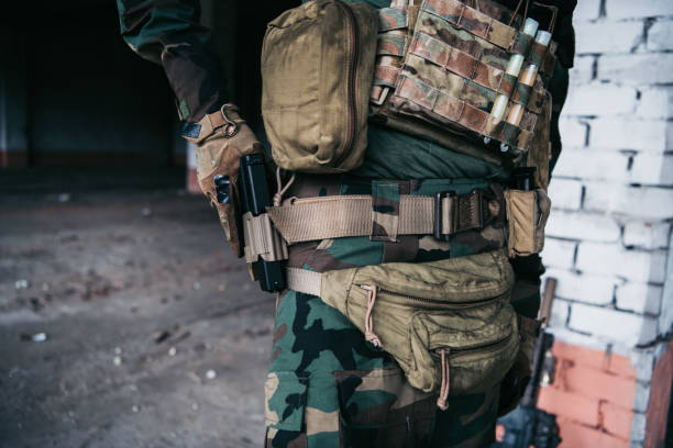 istock Soldier preparing tactical gear for action battle 1271611401