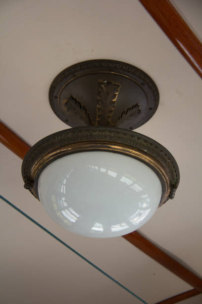 istock antique light fixture in passenger rail car 1271614253