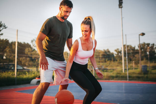 istock Happy Couple Playing Basketball 1271614936