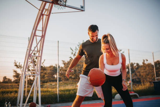 istock Happy Couple Playing Basketball 1271614946
