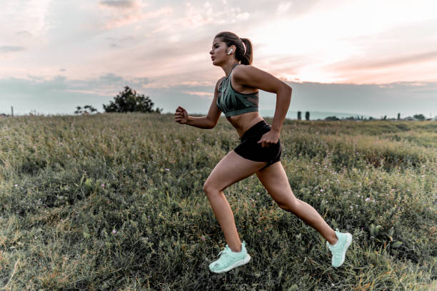 istock Young woman running in nature 1271616444