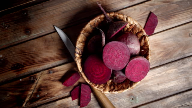 Rotating fresh pieces of beets in the basket.