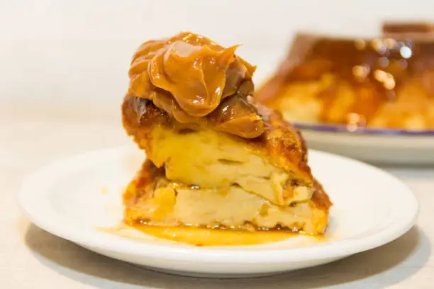 bread pudding made with stale bread, milk, eggs and sugar, decorated with liquid caramel and dulce de leche