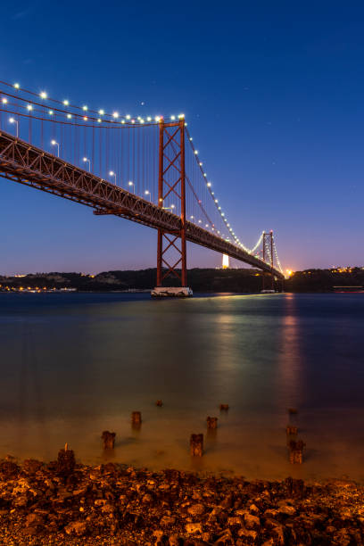 Beautiful view to 25 de Abril Bridge over Tejo River on early night in Lisbon, Lisbon, Portugal