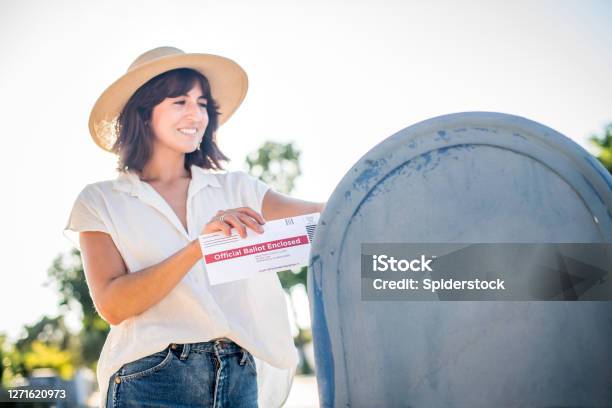 Woman Mailing Her Absentee Voter Ballot Stock Photo - Download Image Now - Mailbox, United States Postal Service, Voting Ballot